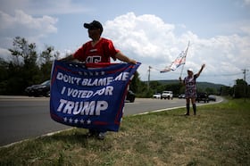 Demonstrators gather in support for former president Donald Trump near Trump National Golf Club on Sunday in Bedminster, N.J.